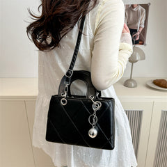 Casual, minimalist, and uniquely designed small square bag.