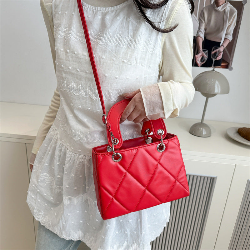 Casual, minimalist, and uniquely designed small square bag.