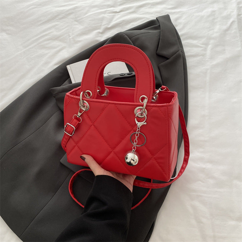 Casual, minimalist, and uniquely designed small square bag.